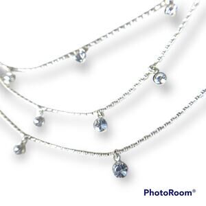 Tri-strand silver tone rhinestone accent necklace
